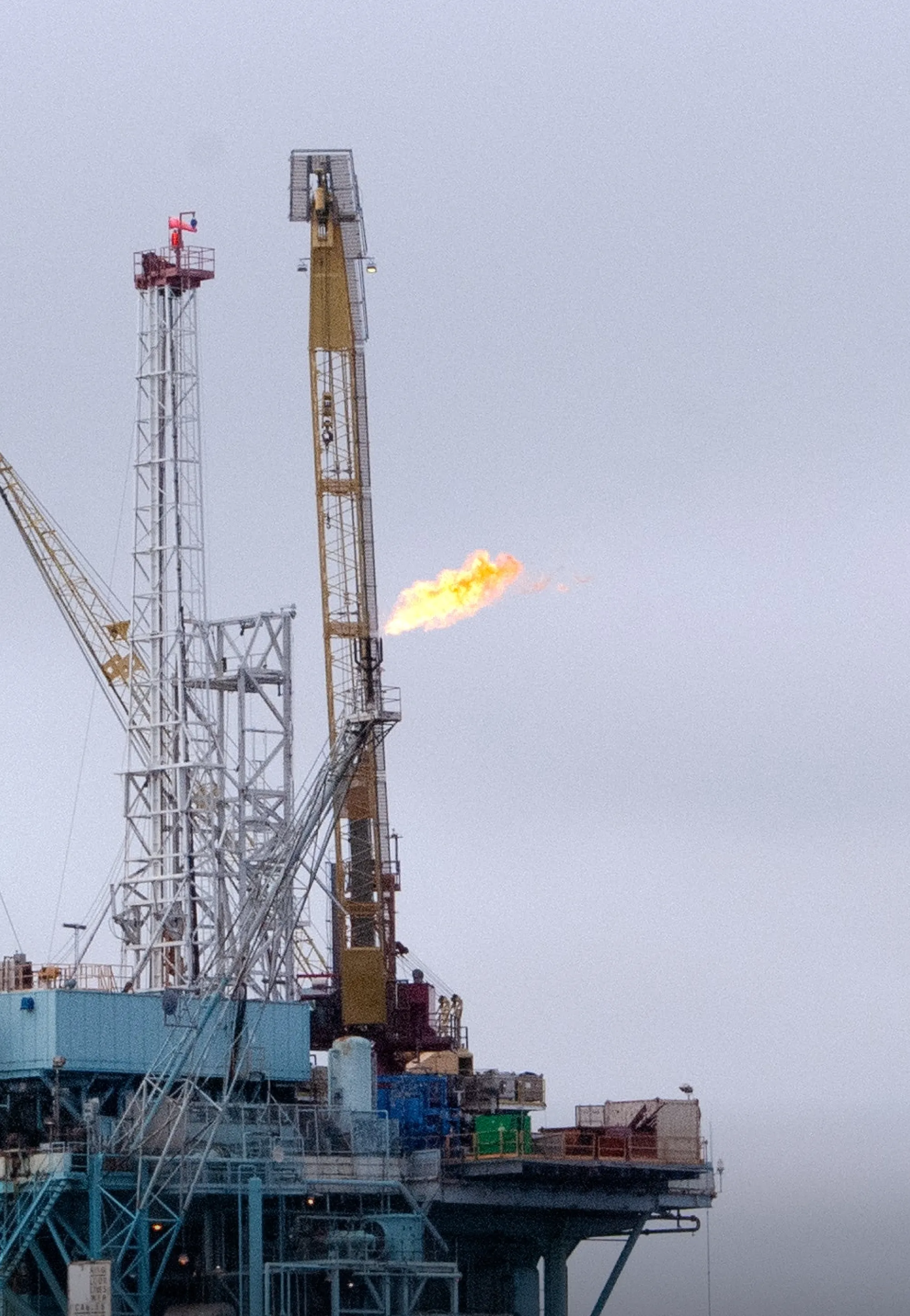 An afternoon image of containers stacked against and on top of each other.